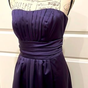 David’s Bridal purple bridesmaid dress in size 4. Already dry cleaned!